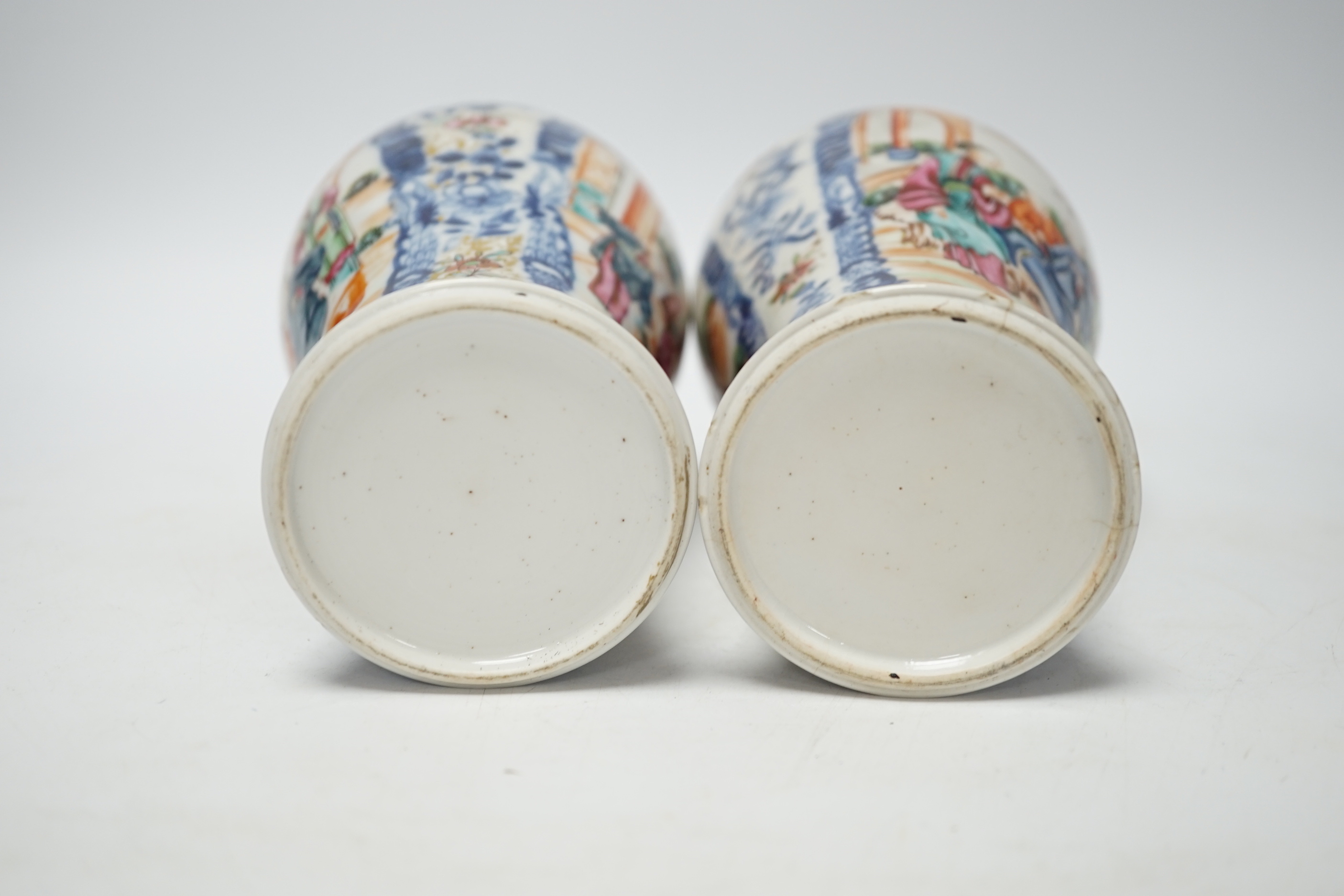 A pair of late 18th century Chinese famille rose ‘mandarin’ vases, 19cm high
